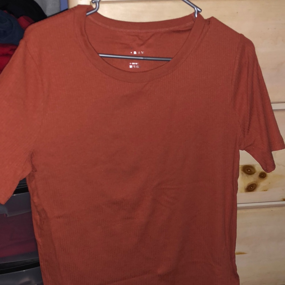 Orange “A New Day” short sleeve t-shirt.